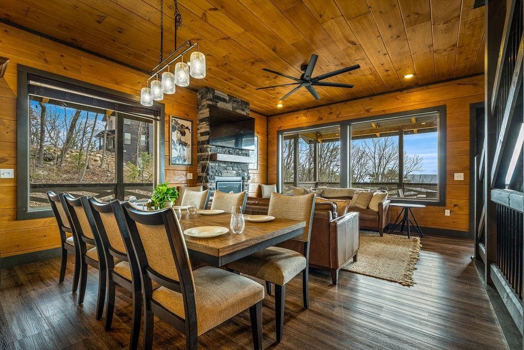 Turnkey luxury short-term-rental cabin great room, fresh pillows and quilts styled on the bed, ready for guests
